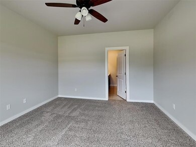 Unfurnished room featuring light carpet and ceilin