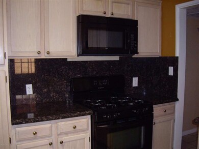 GAS STOVE AND GRANITE BACK SPLASH