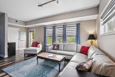 Spacious living room.  Electronic blinds throughout the home.