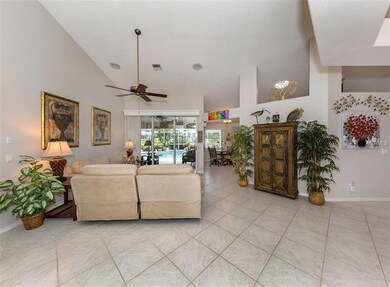 Living room with slider to lanai and pool