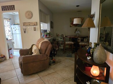 Living room with light tile patterned floors