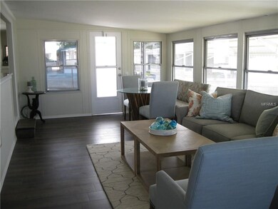Living Room - Dining Room with door to rear porch.