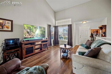 Living room with dark hardwood / wood-style floors