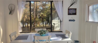 Kitchen and dining look out to lake