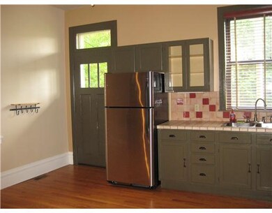 Kitchen. Rear kitchen door out to covered back pat