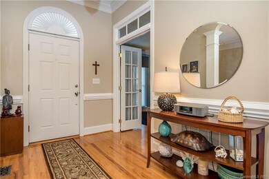Welcoming Foyer opens to Dining Room and Study
