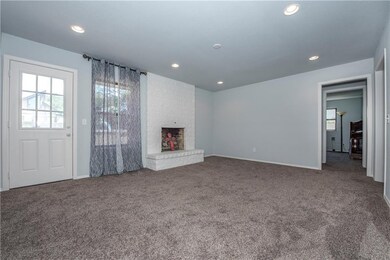 Living room and door leads to the backyard.