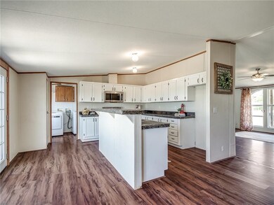 kitchen has tons of cabinets, pantry, bar, and ss 