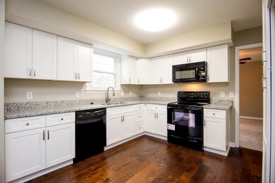 New kitchen with granite counters.