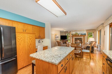 Kitchen area flows into informal dining area and family room.