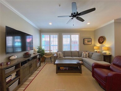 Living room featuring ornamental molding, ceiling