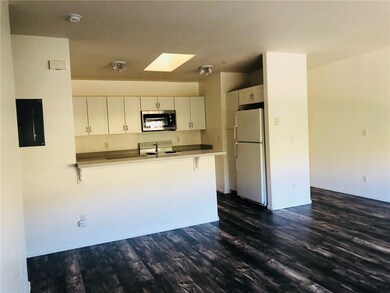 Open floor plan with the kitchen and living room a