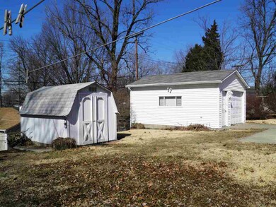 View of the garage and yard barn.