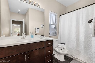 Bathroom with toilet, plenty of natural light, van