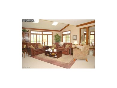 The family room has lots of natural light, a firep