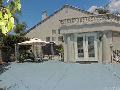 Separate sitting area in backyard with waterfall a