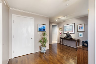 Spacious foyer opens to powder bath, two bedrooms