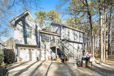 Rear view of house featuring a garage