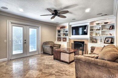 Beautifully upgraded family room has Travertine fl