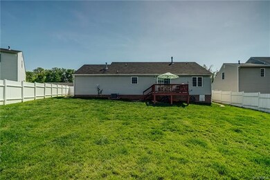 Backyard has low maintenance vinyl privacy fence a