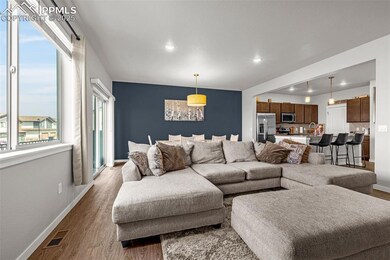 Living area featuring wood finished floors and recessed lighting