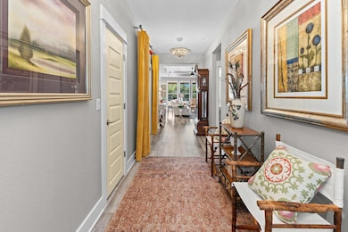 Beautiful entryway leads you into the home and highlights the greenbelt views.