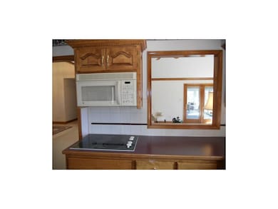 Pass-thru window to great room to stay connected!