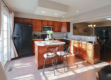 Sliding glass doors off the kitchen lead to your d