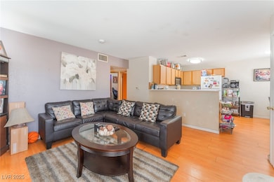 Unit A Living area featuring light wood-style floo
