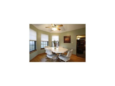 Breakfast Bar. Breakfast nook w/ oak flooring..