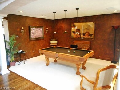A billards room off of the inviting foyer with off