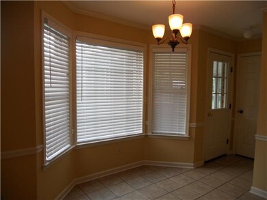 Breakfast area & front entry hall. Blinds througho