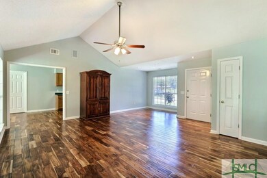 Split floor plan offers privacy with the master su