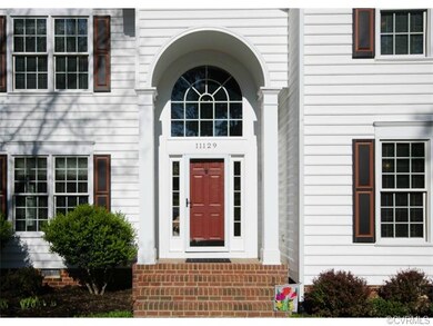 The front entry has an attracted arched covered po