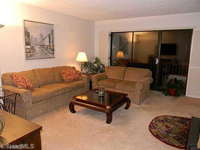 Living Room. Spacious Living Room with access to Deck and Lake Views