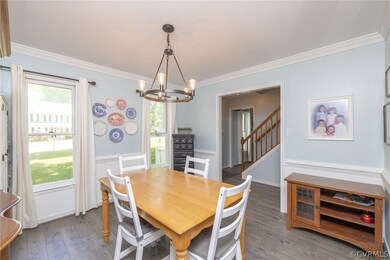 Dining space with hardwood / wood-style flooring,