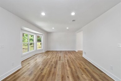 Empty room with recessed lighting, baseboards, vis