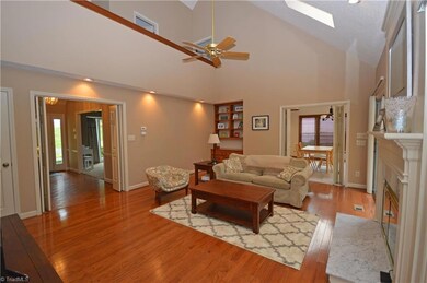 Walking straight ahead from front door brings you to an expansive LR/Den with vaulted ceiling & skylights!