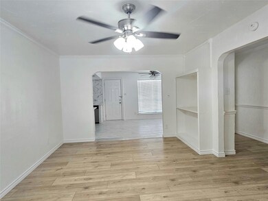 Tiled spare room with ceiling fan