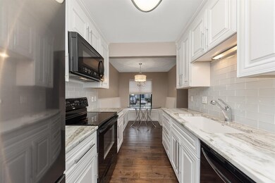 Gorgeous white cabinetry, gorgeous granite countertops, newer black stainless appliances and tile backsplash makes this kitchen easy to enjoy!