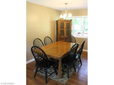 Spacious dining room w/ original hardwood overlook