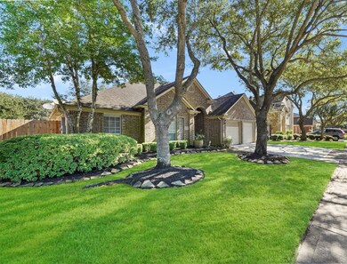 Beautiful curb appeal complete with mature trees and landscaping.