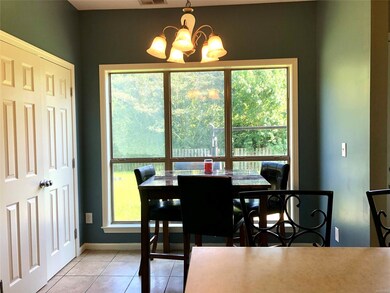 Breakfast area has lots of natural light and view 