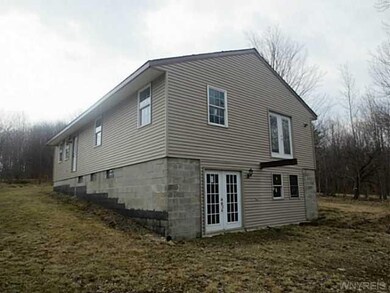 Exterior Front. Upper French door are from the mas