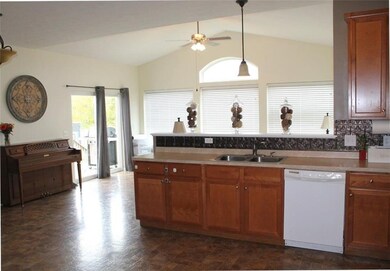 The kitchen overlooks the morning room and the sli