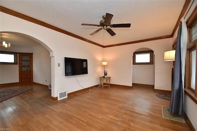 Living room with stairway entrance and dining Room.