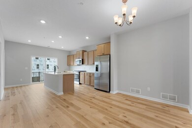 The dining space can accommodate a larger table when needed.