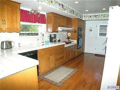 Kitchen with tile counters