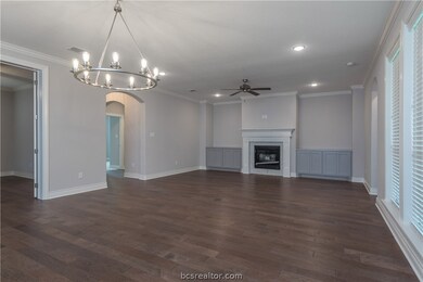 Unique and modern chandelier over the dining area.
