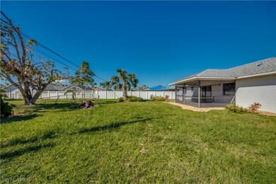Backyard is big enough for a pool. This view is looking west. Fencing shown belongs to neighbors.